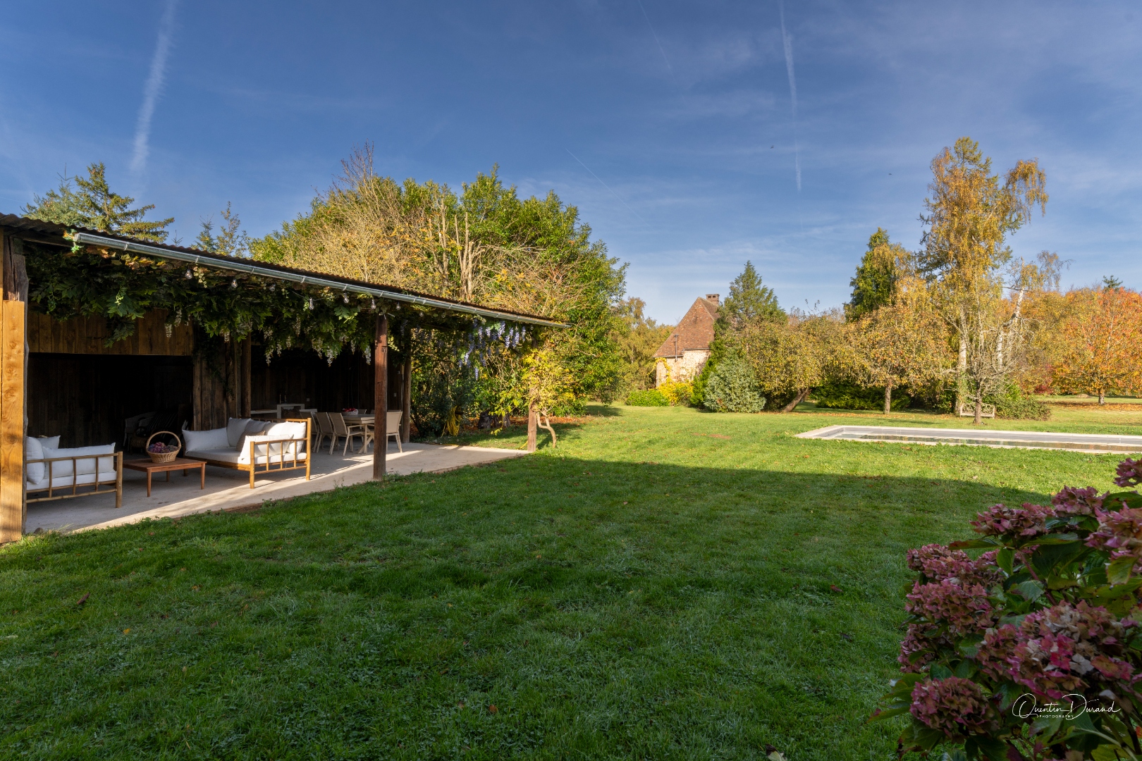 Detail of the covered outdoor lounge with sofas and table