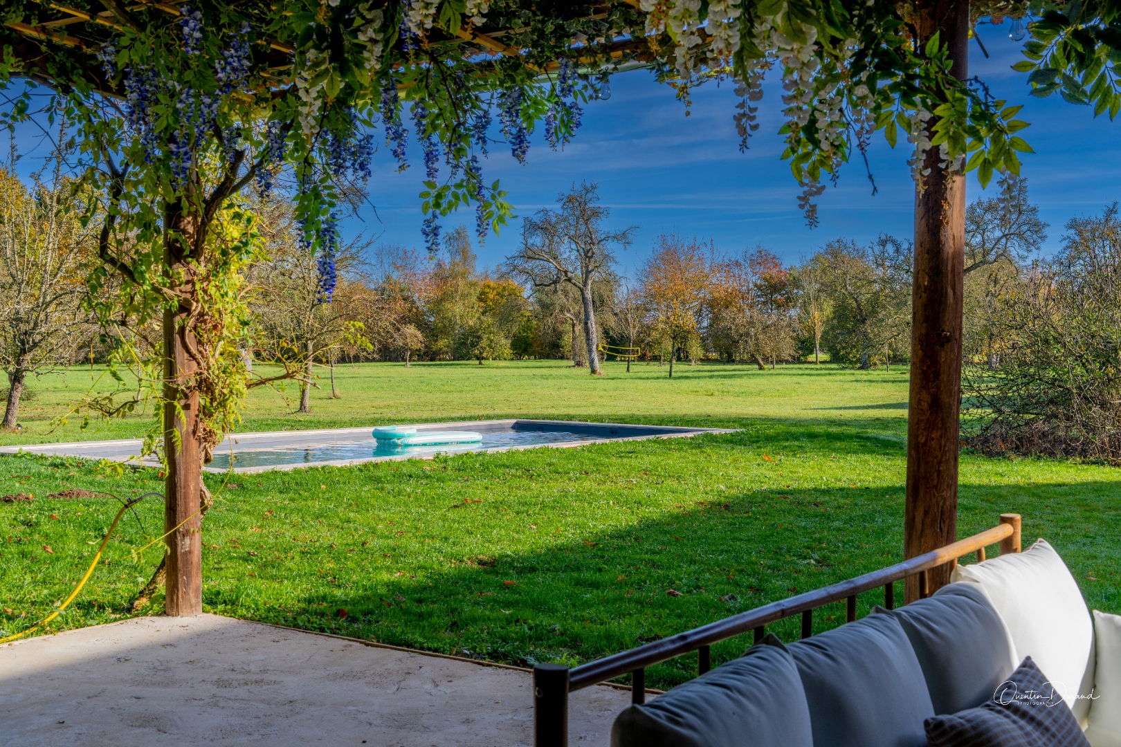 View from the pergola towards the pool and orchard